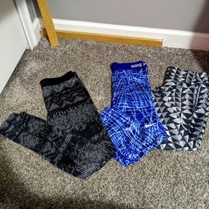3 pairs size large Nike leggings.
